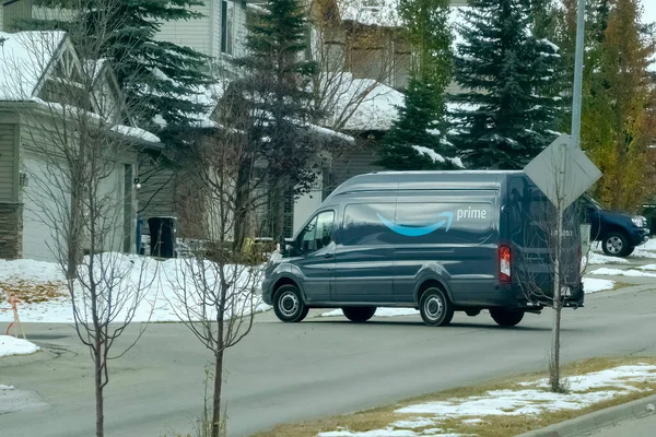 stock image Calgary, Alberta, Canada Nov 10, 2022. An Amazon Prime delivery truck during winter in a residential area.