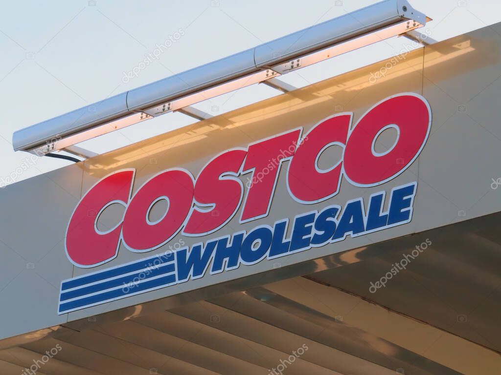 Nov 17, 2022. Calgary, Alberta, Canada. A Costco wholesale sign at a Gas Station.
