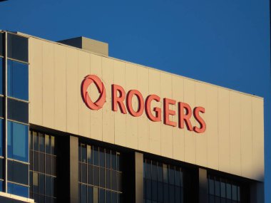 Calgary, Alberta, Canada. Jan 22, 2023. A Rogers signage at the top of a building.
