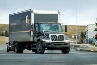 Calgary, Alberta, Canada. Feb 13, 2023. A UPS truck trailer driving during the winter.