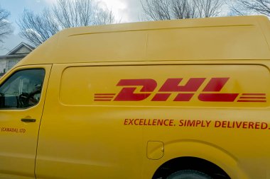 Calgary, Alberta, Canada. Feb 19, 2023. A close up to a DHL truck logo.