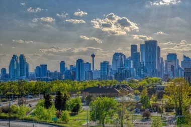 A Calgary Downtown skyline during the spring with some dramatic clouds. clipart