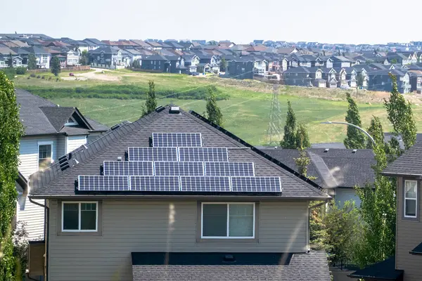 stock image Calgary, Alberta, Canada. Jun 8, 2023. A house with solar panels on the roof.