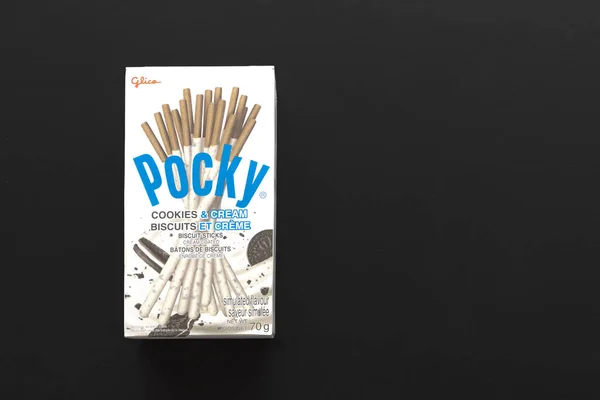 stock image Calgary, Alberta, Canada. Jun 25, 2023. A box of biscuit sticks, cookies and cream Pocky, a Japanese sweet snack food produced by the Ezaki Glico food company.