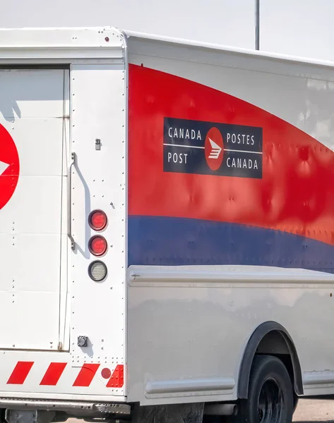 stock image Calgary, Alberta, Canada. Aug 7,2023. A close up to a Canada Post truck on the route during summer time.