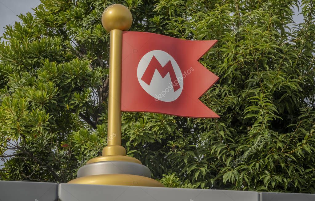 Osaka, Japan. Nov 14, 2023. Close up to Mario Bros flag at the Super Nintendo World a themed area at Universal Studios Japan.