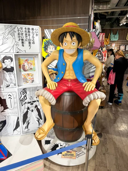 stock image Kita Ward, Osaka, Japan. Dec 24, 2023. A Human Size Model of Monkey D. Luffy from a Japanese Animation One Piece a comic cartoon character figure at a Jump Shop at HEP FIVE mall.