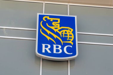 Calgary, Alberta, Canada. Mar 6, 2024. A close up to an RBC Bank sign Royal Bank of Canada a Canadian multinational financial services company and the largest bank in Canada. clipart