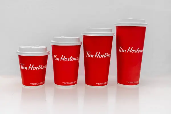 stock image Calgary, Alberta, Canada. May 3, 2024. Different sizes of Tim Hortons coffee cups.