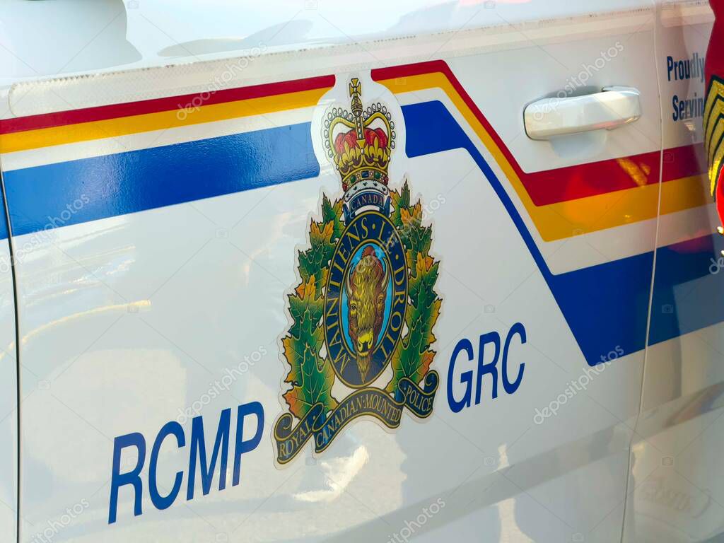 Calgary, Alberta, Canada. Jul 10, 2024. A close-up front view of the emblem on a Royal Canadian Mounted Police (RCMP) vehicle.