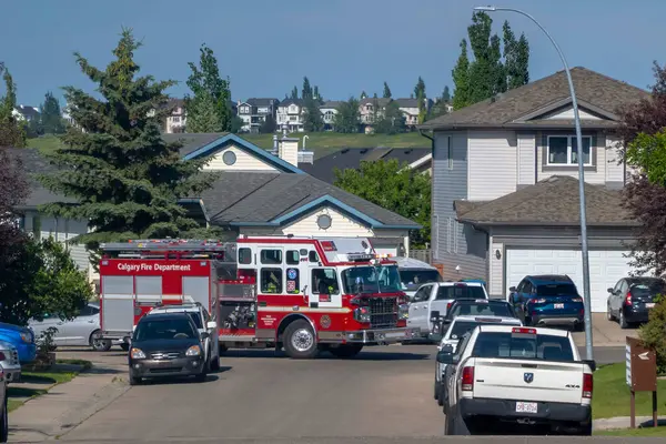 stock image Calgary, Alberta, Canada. Jul 14, 2024. A Calgary Fire department truck parked in a residential area serving an emergency call.