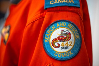 Calgary, Alberta, Canada. Jul 26, 2024. A close-up of a vibrant orange Search and Rescue uniform, highlighting the 