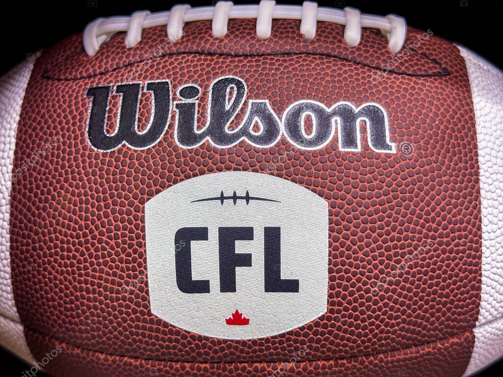 Calgary, Alberta, Canada. Apr 8, 2025. A close-up showcases a brown Wilson football with white laces and the CFL logo featuring a maple leaf.