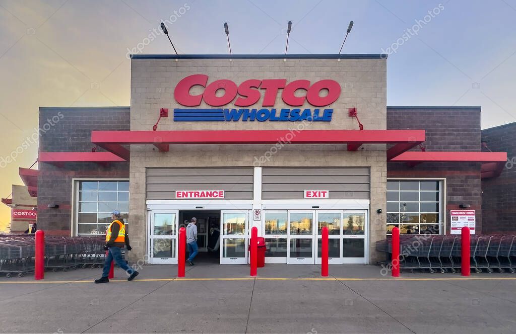 Calgary, Alberta, Canada. Apr 10, 2025. Exterior shot of a Costco Wholesale store at dusk with 