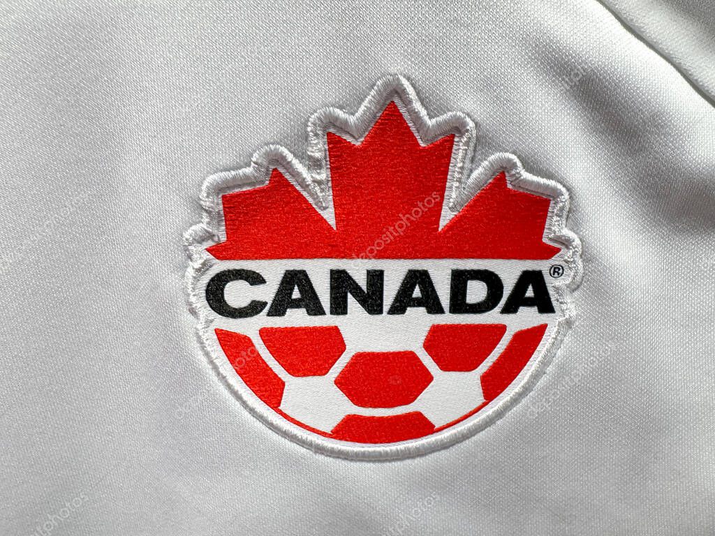 Calgary, Alberta, Canada. Apr 16, 2025. A close-up of the Canada National Soccer Team logo featuring a red maple leaf, the word 