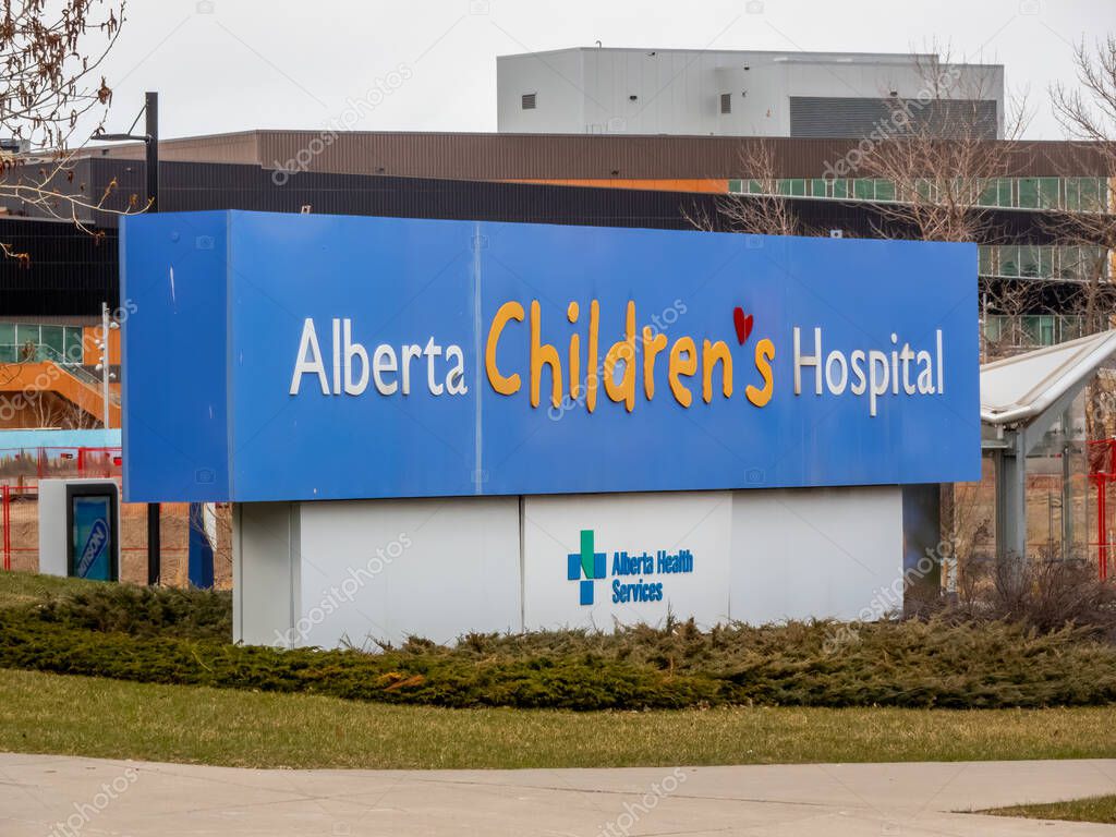 Calgary, Alberta, Canada. Apr 24, 2025. A prominent blue and white sign reads 