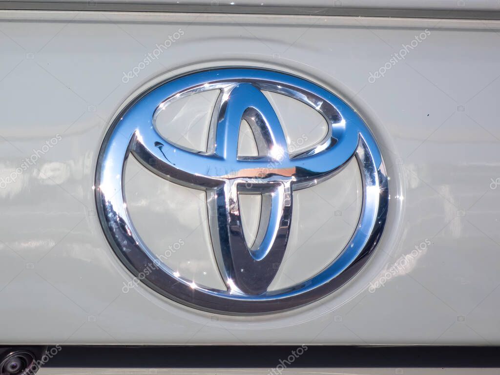 Calgary, Alberta, Canada. Apr 25, 2025. A close-up shot shows the chrome emblem of Toyota, featuring three overlapping ellipses forming a stylized 