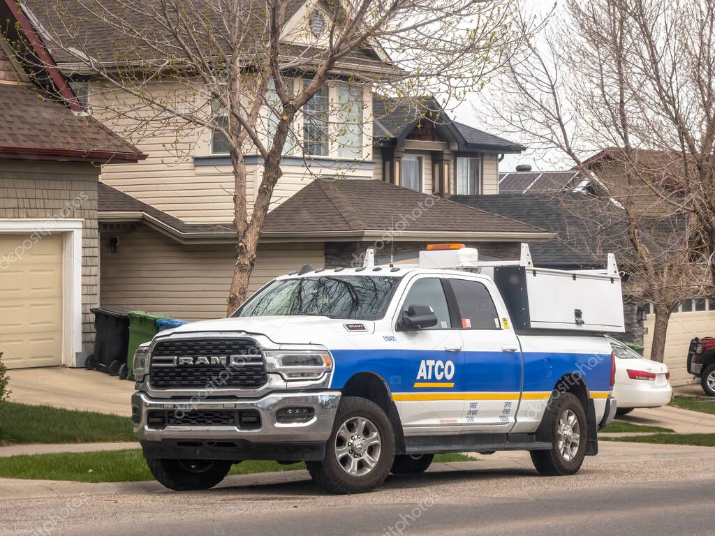 Calgary, Alberta, Canada. May 9, 2025. A white and blue Dodge RAM 2500, marked with the ATCO logo parked on a suburban street.