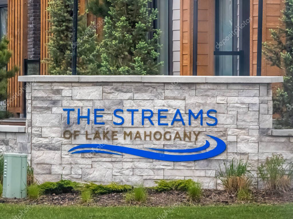 Calgary, Alberta, Canada. Jun 8, 2025. A clear view of a stone sign marking 