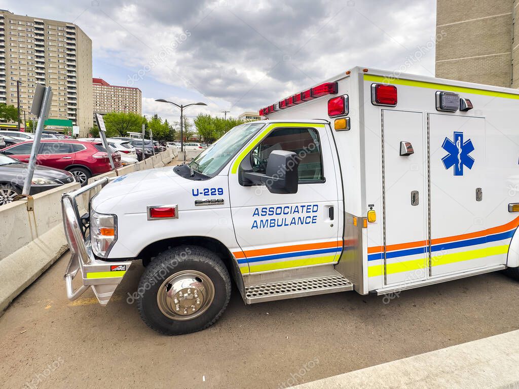 Edmonton, Alberta, Canada. Jun 17, 2025. An Associated Ambulance vehicle, ready for emergency response, is parked in a lot, highlighting vital medical services in an urban setting.