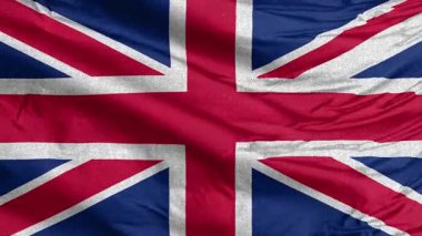 İngiliz bayrağının desenli yakın çekimi, doğal kumaşlı ikonik kırmızı, beyaz ve mavi tasarımını sergiliyor.