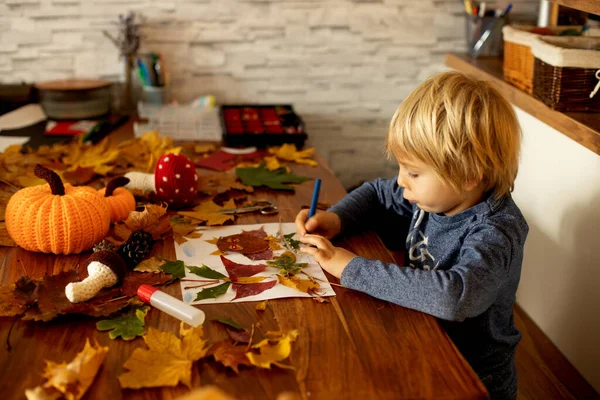 Child Applying Leaves Using Glue Scissors Paint While Doing Arts — Stock Photo, Image