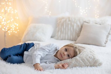 Valentine portrait of a little cute child with hearts, roses and sign