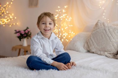 Valentine portrait of a little cute child with hearts, roses and sign