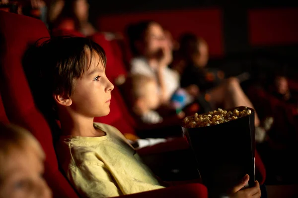 Cute Child Boy Watching Movie Cinema Eating Popcorn Enjoying Film — Fotografia de Stock