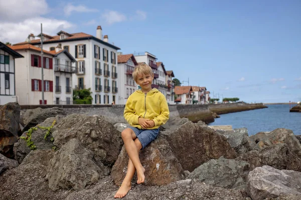 Family, visiting small town in France, Saint Jean de Luz, during summer vacation, traveling with children in Europe