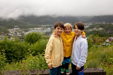 People, enjoying the scenery view from valley in the western part of Norway. Kvinesdal in county Rogaland, Norway clipart