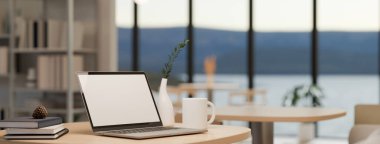 Yakın çekim yan görüntü, taşınabilir laptop beyaz ekran maketi ve modern kahve dükkanında ahşap masa üstü ya da çalışma alanı gibi şeyler. 3d görüntüleme, 3d illüstrasyon