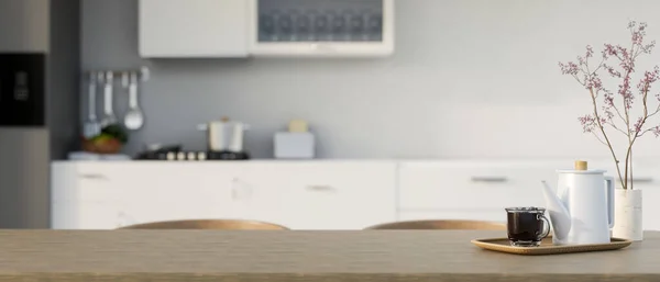 ティーポット コーヒーカップ 陶器の花瓶が背景にぼやけたモダンな白いキッチンの調理スペースの上に最小限の木製のダイニングテーブルに製品を表示するためのスペースをコピーします 3Dレンダリング 3Dイラスト — ストック写真