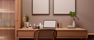 Minimalist ve rahat çalışma alanı ahşap mobilyalar, dizüstü bilgisayar ve ahşap masa üzerindeki dekorla duvardaki boş çerçeveye karşı. 3d görüntüleme, 3d illüstrasyon