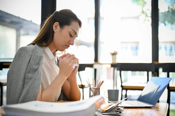 stock image Sad and depressed millennial Asian businesswoman upset and dissatisfied with her work, crumping paper, crying at her desk.