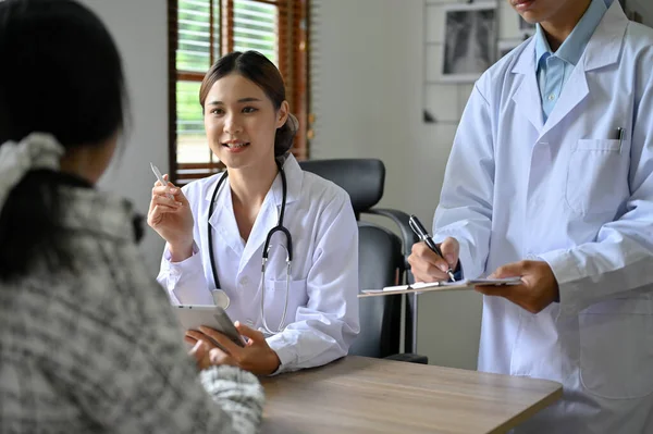 Professional Expert Asian Female Doctor Her Assistant Examination Office Discussing Stock Picture