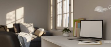 Yakın plan görüntü, laptopun beyaz ekran maketi beyaz bilgisayar masasında minimal apartman dairesi oturma odasında. 3d görüntüleme, 3d illüstrasyon