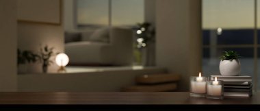 Copy space for montage your product display on wood tabletop with burning candles, books, and decor plant over blurred background of cozy living room. 3d render, 3d illustration
