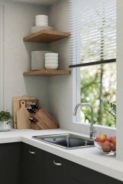 Modern sink with faucet on kitchen tabletop against the window, kitchenware on wood shelf, kitchen stuff and decor in modern kitchen room. close-up image. 3d render, 3d illustration
