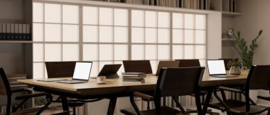 Modern office co-working room or meeting room interior design with meeting table, armchairs, laptop computer, office supplies and decor. 3d render, 3d illustration