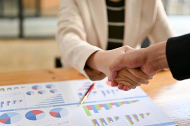 close-up hand image, Two successful businesspeople shaking hands after close the business deal.