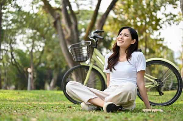 Happy Carefree Young Asian Woman Casual Clothes Sits Grass Looking —  Fotos de Stock