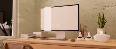 Minimal vintage rustic home workspace interior design with PC computer blank screen mockup, VR game set, painting tools, and decor on wood table against rustic cement wall. 3d render, 3d illustration