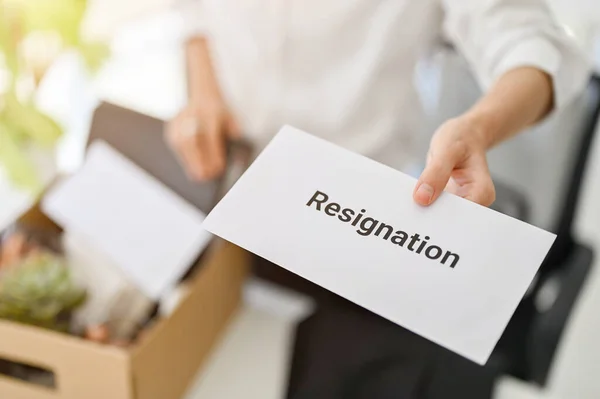 close-up image of a businesswoman sending a resignation letter. unemployment, resignation, career failure, leaving job, changing a job for better position.