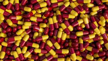 Pile of pills background, pill capsules in yellow and red. drug or vitamin capsules. 3d render, 3d illustration