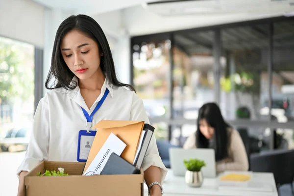 Sad Upset Millennial Asian Female Office Worker Holding Cardboard Box — 图库照片