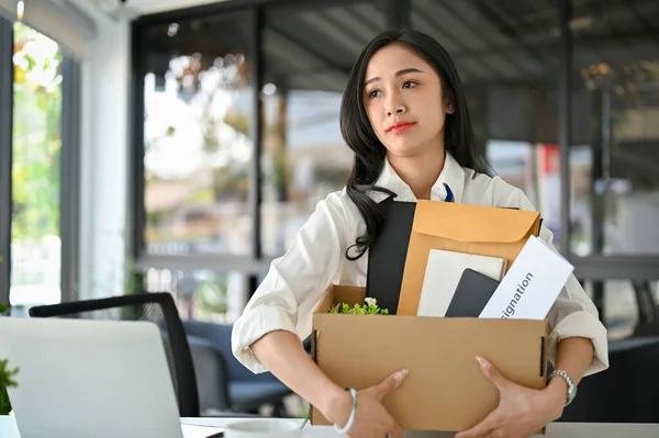 Unhappy Millennial Asian Female Office Worker Carrying Her Belongings Resignation — 图库照片