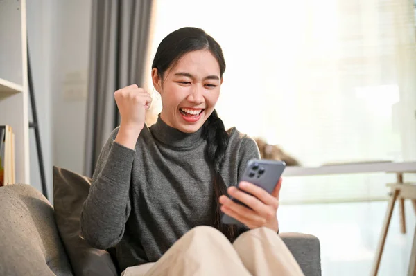 Overjoyed Happy Young Asian Woman Relaxing Sofa Living Room Showing — Stock Photo, Image