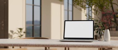 Çalışma alanı dizüstü bilgisayar beyaz ekran maketi, çiçek vazosu, kırtasiye ve oturma odasının bulanık arkaplanı üzerine kopyalama alanı. 3d görüntüleme, 3d illüstrasyon