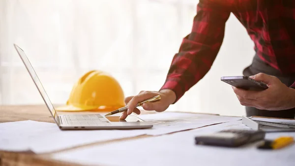 stock image Close-up image of a professional male engineer working on his project on laptop in the office.